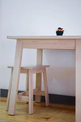 a wooden table with a potted plant on top at Aurora Street in Porto