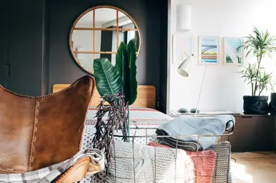 a living room with a table with a mirror at HOMEinTOWN Camões - Modern and Quiet Central Studio - AC & Fast WiFi Near Trindade Metro Station in Porto