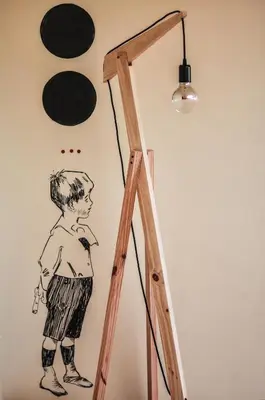 a drawing of a boy on a wall at The Poets Inn in Porto