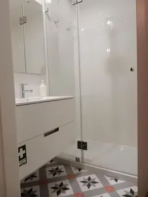 a bathroom with a shower and a sink at Porto Traveler Apartment in Porto