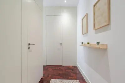 a shower in a bathroom with white walls at Renovated & Quiet 1-Bedroom in Santa Catarina in Porto