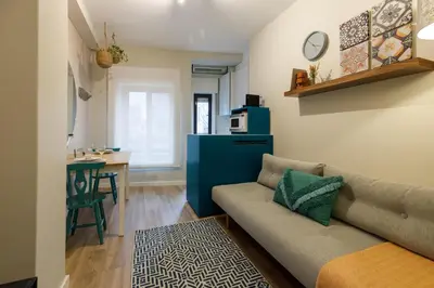 a living room with a couch and a table at Porto Haven - Downtown by the Metro in Porto