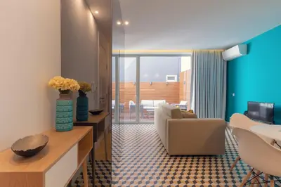 a living room with a couch and a table at Porto Blue Terrace in Porto