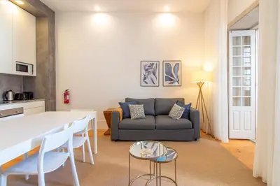 a living room with a couch and a table at LovelyStay - Dirk Apartment Almada 3º T in Porto