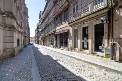 an empty street in a city with buildings at LovelyStay - Dirk Apartment Almada 3º T in Porto