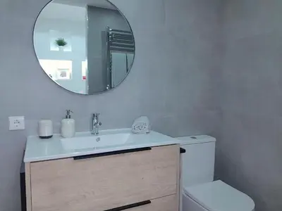 a bathroom with a sink and a mirror at Casa de Cristal by Oporto Soul in Porto