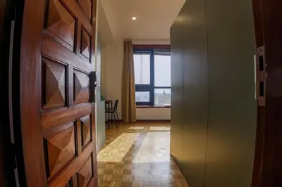 a hallway with a door and a room with a window at Casa de Cristal by Oporto Soul in Porto