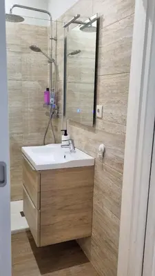 a bathroom with a sink and a shower at Oporto Downtown in Porto