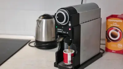 a coffee maker with a cup of coffee at Oporto Downtown in Porto