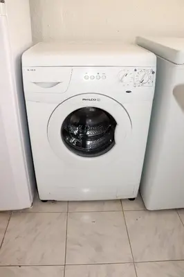 a white washer and dryer in a kitchen at Porto Patricio Apartments in Porto
