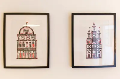 two framed drawings of a building and a clock tower at Porto Haven - Marquês Downtown in Porto