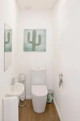 a white bathroom with a toilet and a sink at APOSENTUS - Your home at Pinheiro's Residence in Porto