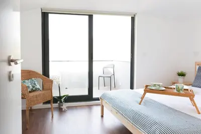 a living room with a couch and a table at APOSENTUS - Your home at Pinheiro's Residence in Porto