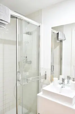 a bathroom with a shower and a sink at Mezzanine cozy house in Porto