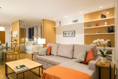 a living room with a couch and a table at Merc Porto Cedofeita Place in Porto