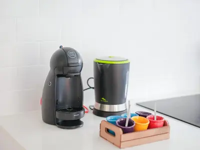 a coffee maker sitting on top of a counter at CM Vintage Apartments in Porto
