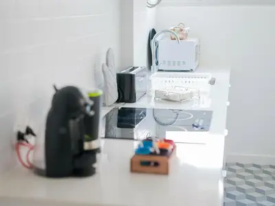 a toy kitchen with a toy dog on a counter at CM Vintage Apartments in Porto
