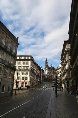 a city street with buildings and a car on the road at Min Porto Inn in Porto