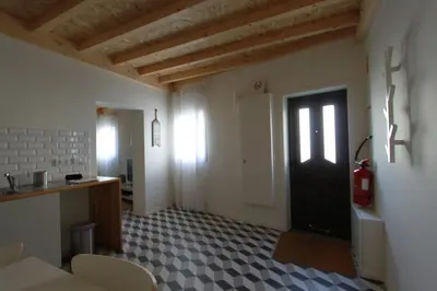 a room with a black door and a tile floor at Oporto City Cottage in Porto