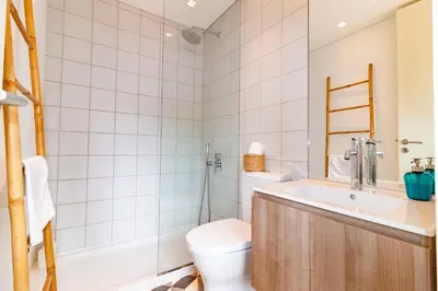 a bathroom with a toilet and a sink at Casulo Loft - Oporto Downtown in Porto