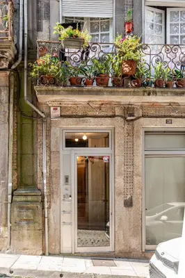 a building with potted plants on top of it at Belomonte 22 Apartments Porto World Heritage in Porto