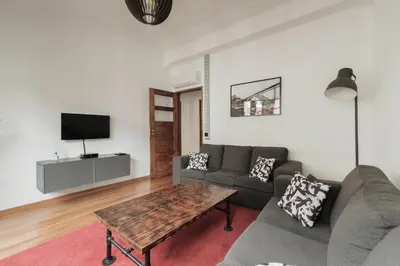a living room with a couch and a table at Puro Apartment in Porto