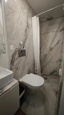 a bathroom with a sink and a toilet and a shower at InvictaViews Loft in Vila Nova de Gaia