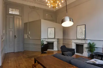 a living room with a couch and a table at Oporto Royal Apartment - Solar da Avenida in Porto