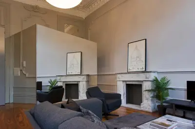 a living room with a couch and two fireplaces at Oporto Royal Apartment - Solar da Avenida in Porto