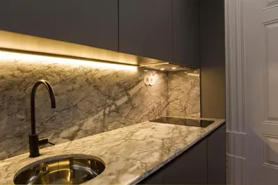 a kitchen with a sink and a counter at Oporto Royal Apartment - Solar da Avenida in Porto