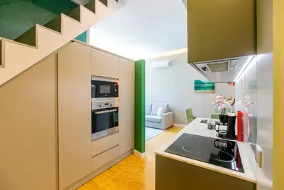 a kitchen with a sink and a stove top oven at Casa da Cordoaria by Oporto Soul in Porto