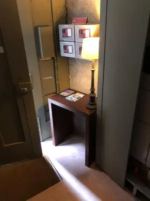 a room with a table with a lamp on it at PortoSense Ribeira in Porto