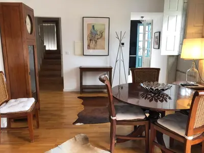 a dining room with a table and chairs at PortoSense Ribeira in Porto