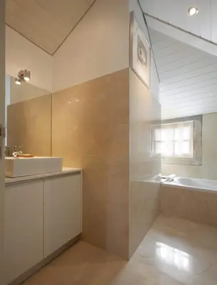 a bathroom with a tub and a sink and a bath tub at PortoSense Ribeira in Porto
