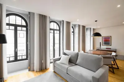 a living room with a couch and a table at Thomaz Palace in Porto
