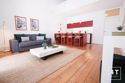 a living room with a couch and a table at Calacatta Housing in Porto