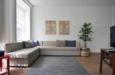 a living room with a couch and a table at Spot Apartments Casa Januario in Porto