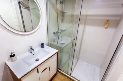 a bathroom with a sink and a shower at Citybreak-Apartments Poveiros in Porto