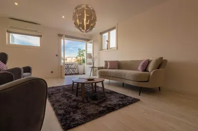a living room with a couch and a table at House General Torres in Vila Nova de Gaia