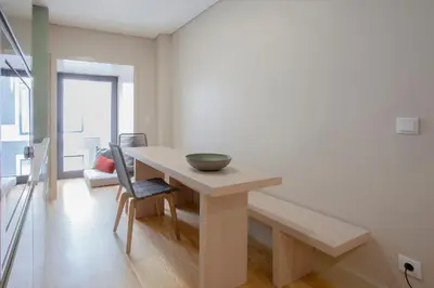 a dining room with a table with a bowl on it at Liiiving in Porto | Luxury Boutique Apartment in Porto