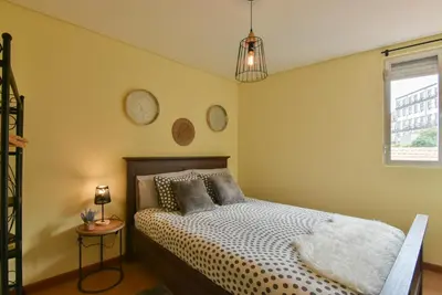 a bedroom with a bed and a window at Clerigos Old Town Apartment in Porto