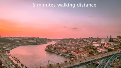 a view of a river with a city and a bridge at Porto Luxury Apartments in Vila Nova de Gaia