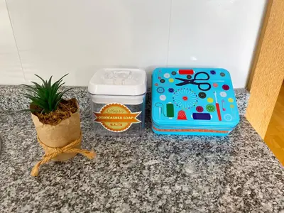 a table with two containers and a potted plant at Vitral House of Art District in Porto