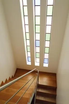 a staircase with skylights in a building with a stair case at Vitral House of Art District in Porto