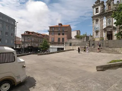 a scooter parked on a sidewalk near the water at FLH Porto Cozy Studio in Porto
