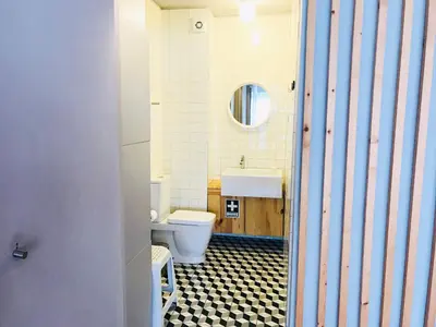 a bathroom with a toilet and a sink at Bolhão Studio in Porto