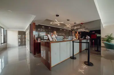 a restaurant with a counter in the middle of a building at ABC Hotel Porto - Boavista in Porto