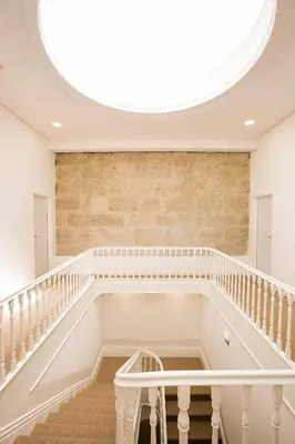 a large skylight in a building with a staircase at BO - Álvares Cabral GuestHouse in Porto
