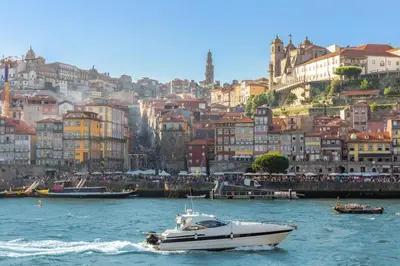 a bedroom with a bed and a large window at Trindade Flat with Great View in Porto