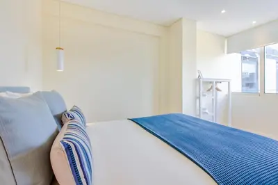 a living room with a couch and a table at Trindade Modern Flat (with Air Conditioning) in Porto